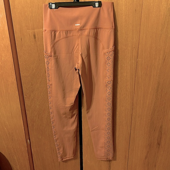Leggings new without tags.  Light burnt orange colour. - Picture 2 of 2